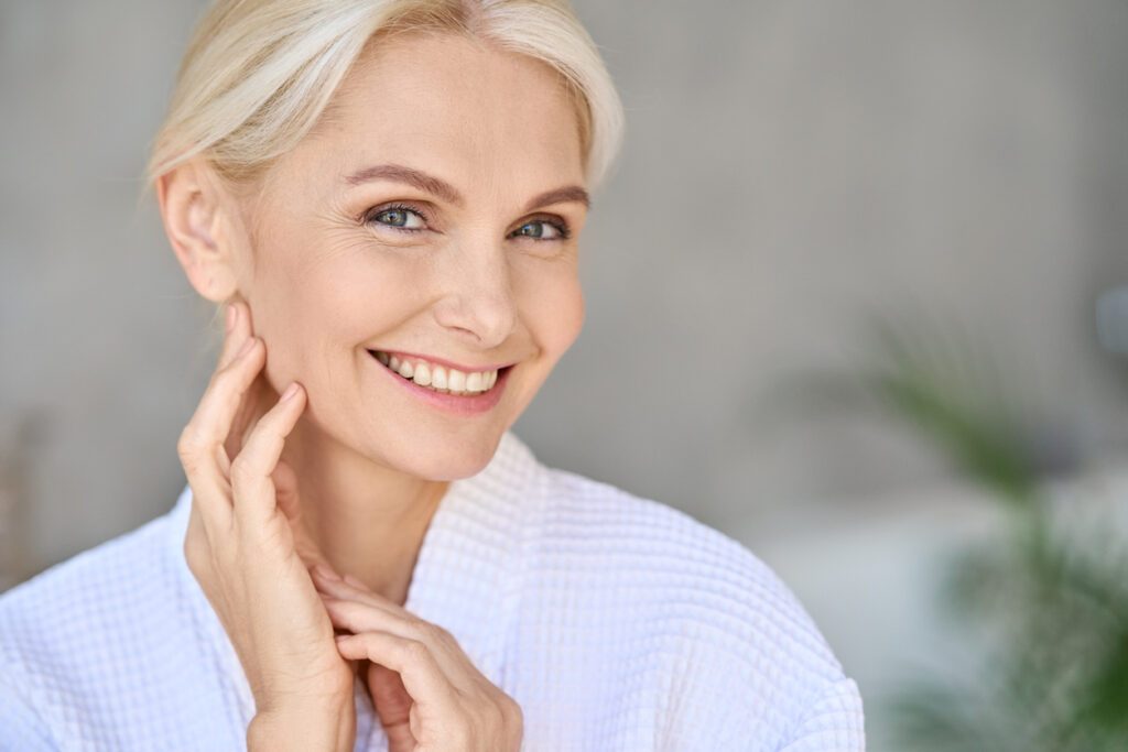woman noticing the anti-aging effects of her Jeuveau® treatments