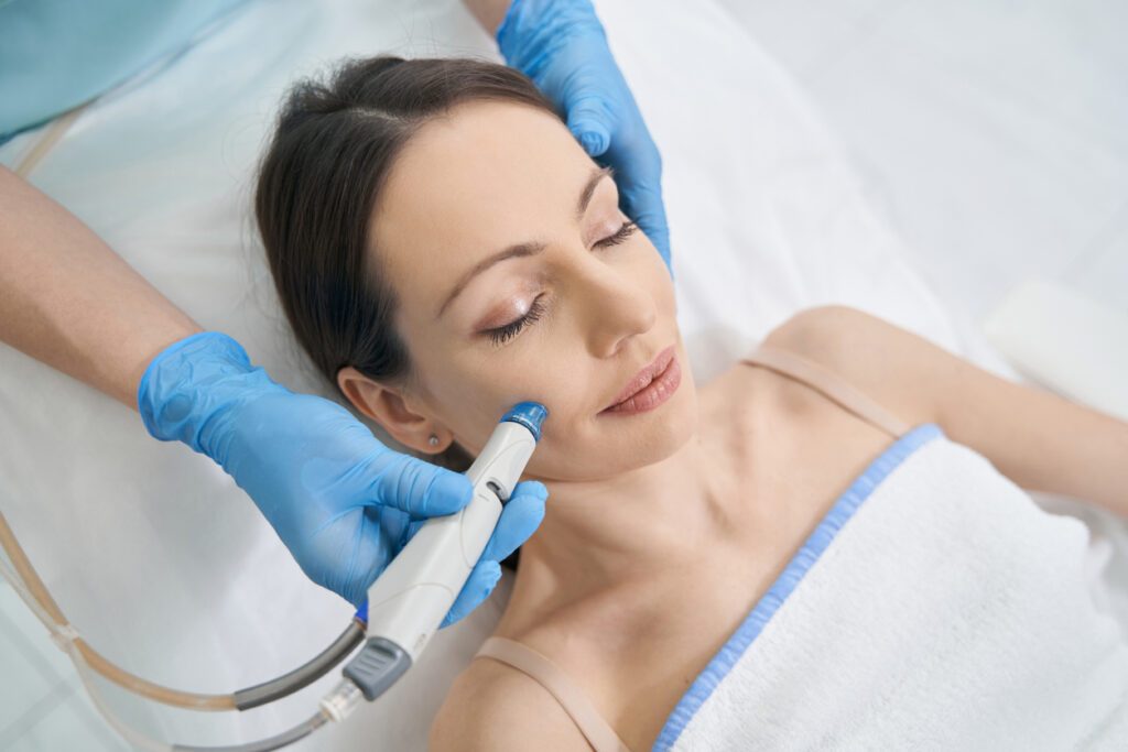 HydraFacial being performed on woman 